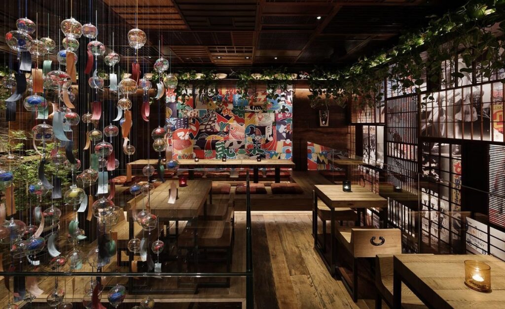 Glass wind chimes hanging above an ICHIBUNS dining room