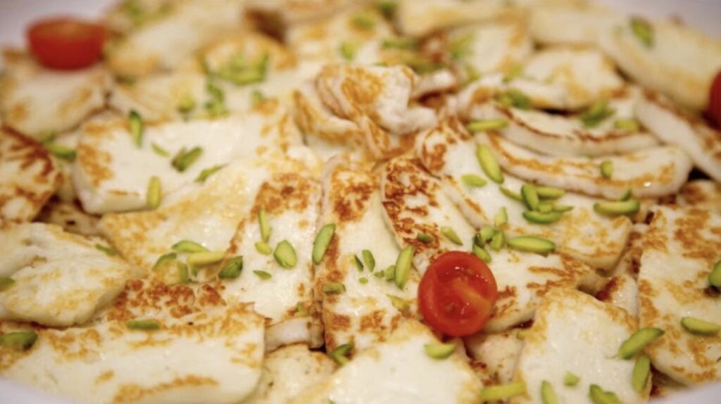 Grilled halloumi with pistachio and cherry tomatoes