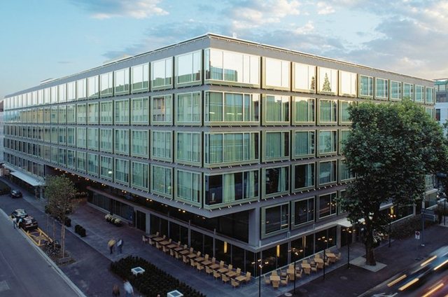 Park Hyatt Zurich at dusk, with its street-level terrace