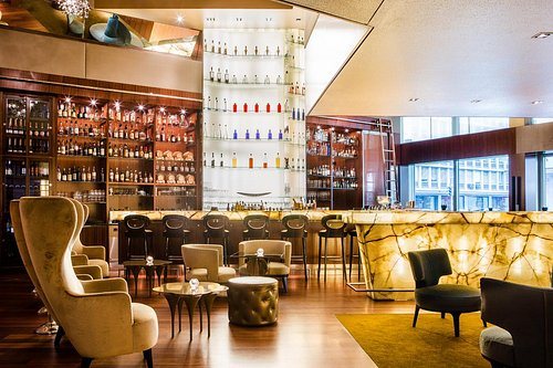 The bar counter and wing chairs at ONYX Bar