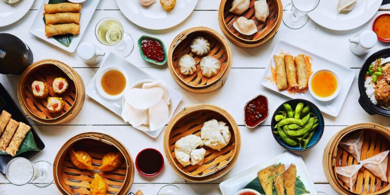 A table of Ping Pong dim sum, from dumplings and spring rolls to edamame